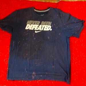 NEVER BEEN DEFEATED. t-shirt